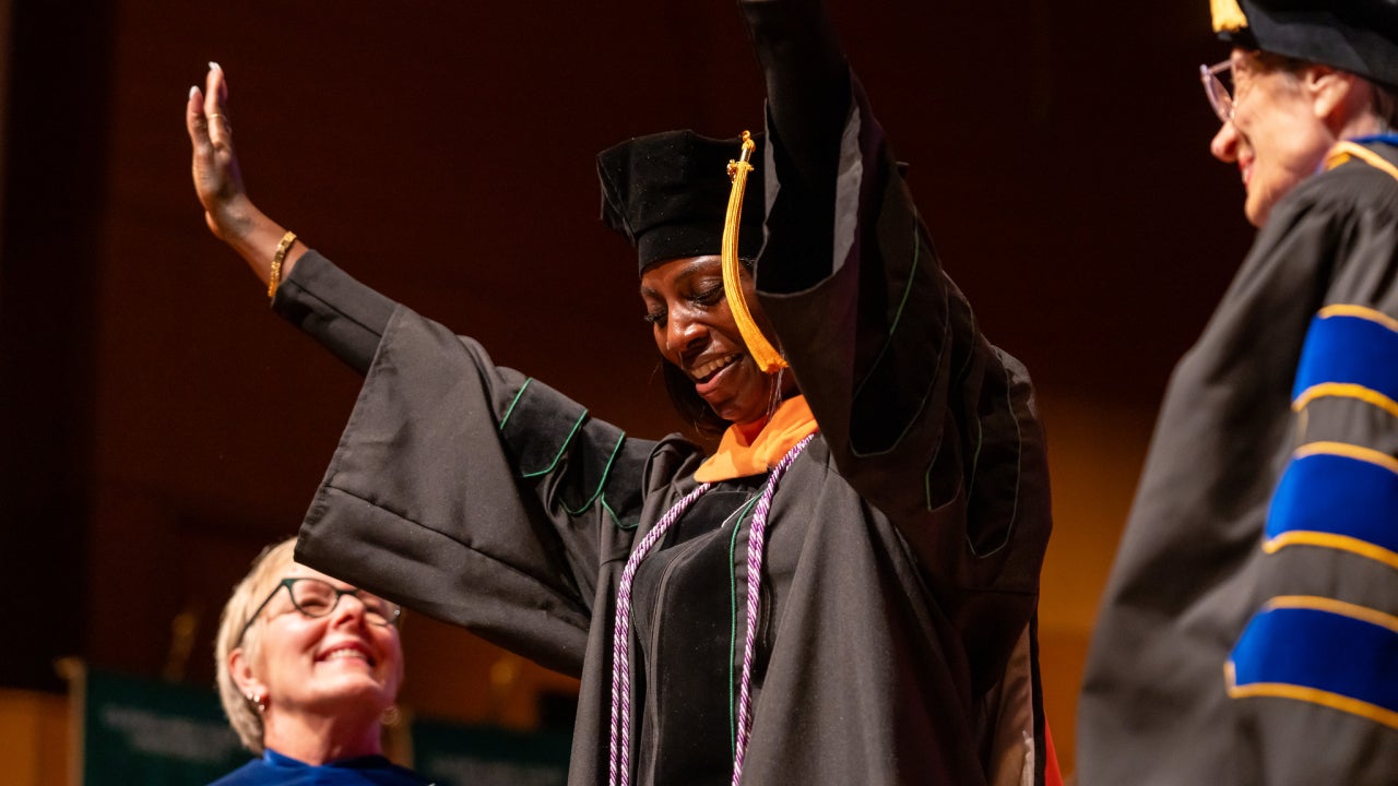 Graduating DNP student with faculty mentor and CSU president