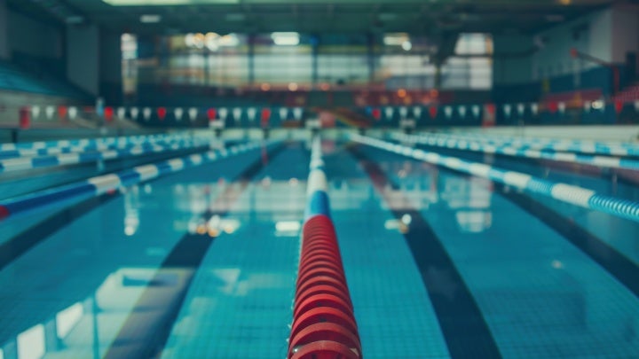 stock image of indoor pool with lanes
