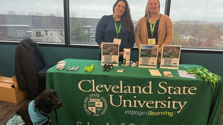 Faculty ready to speak about the Veterinary Social Work program at an event