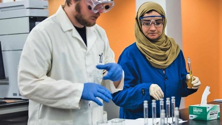 Pair of students working a lab