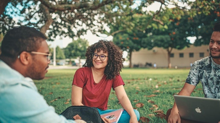 students sitting outside