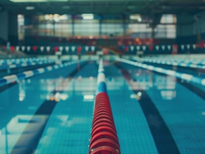 stock image of indoor pool with lanes