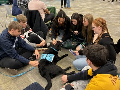 Heddy the dog with students